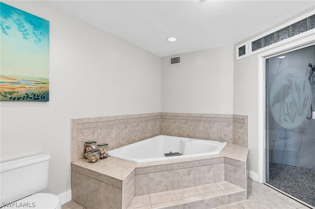 bathroom featuring toilet, separate shower and tub, and tile patterned flooring