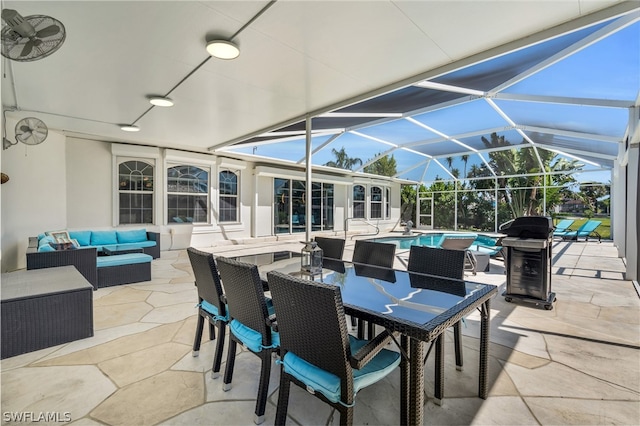 view of patio / terrace featuring an outdoor hangout area, a grill, and glass enclosure