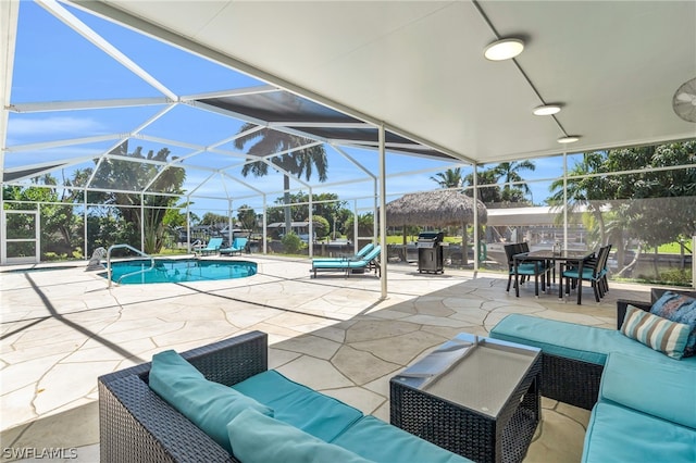 exterior space with glass enclosure and outdoor lounge area