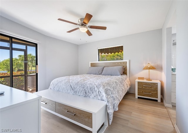 bedroom with multiple windows, light hardwood / wood-style floors, and ceiling fan