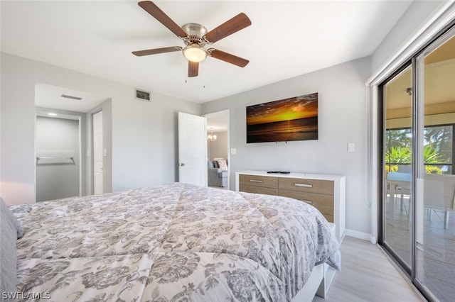 bedroom with ceiling fan, light hardwood / wood-style flooring, and access to exterior