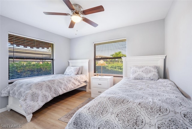 bedroom featuring ceiling fan and light hardwood / wood-style floors