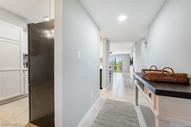 corridor with light tile floors