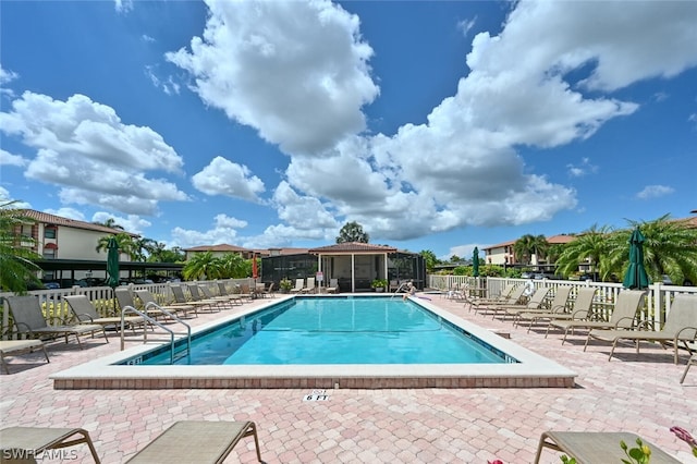 view of swimming pool with a patio area