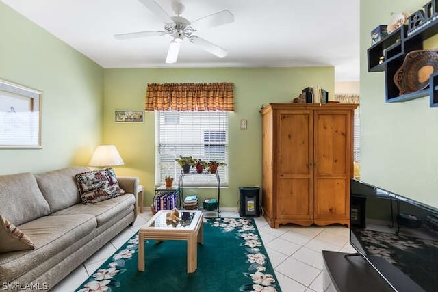 tiled living room featuring ceiling fan