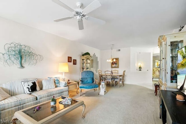 carpeted living room featuring ceiling fan