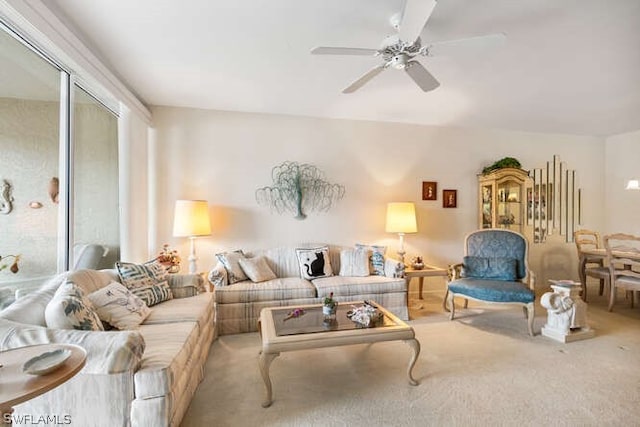 carpeted living room featuring ceiling fan