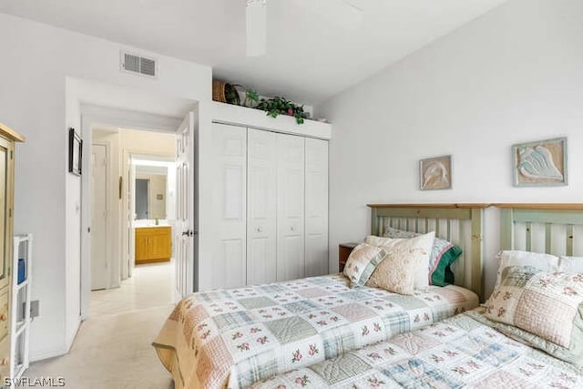 carpeted bedroom with a closet and ceiling fan