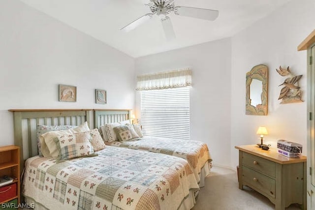 bedroom featuring ceiling fan and light carpet