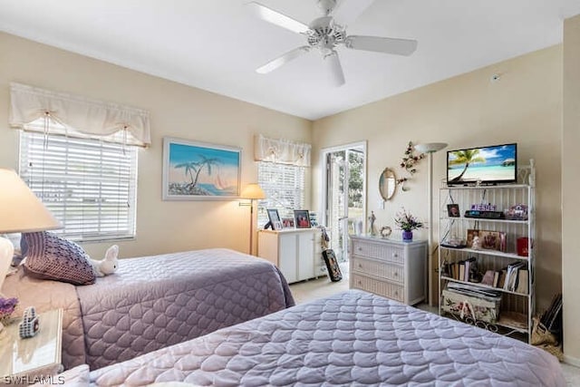 bedroom featuring ceiling fan and multiple windows