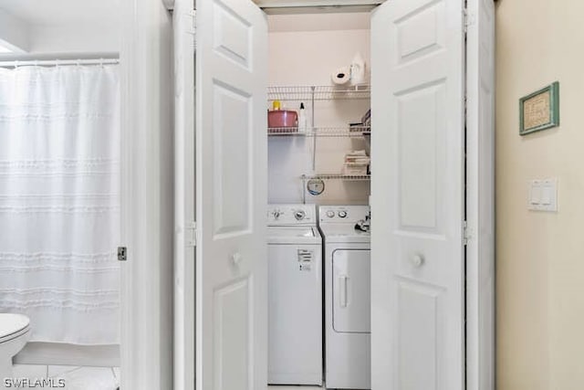 laundry area with washer and clothes dryer