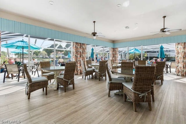 dining room featuring ceiling fan and light hardwood / wood-style flooring