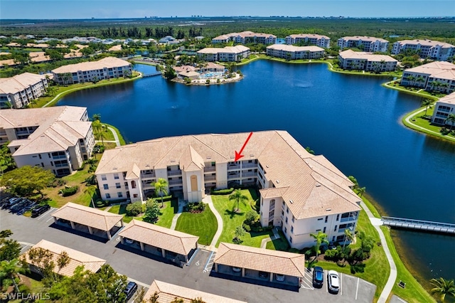 birds eye view of property featuring a water view