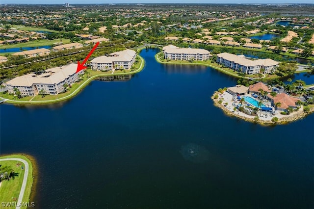 birds eye view of property with a water view