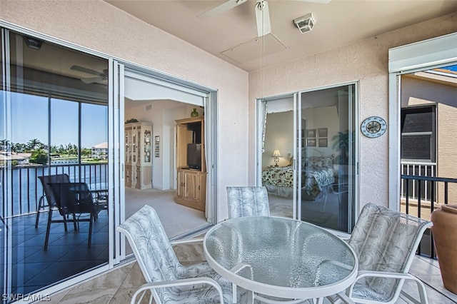 balcony featuring ceiling fan