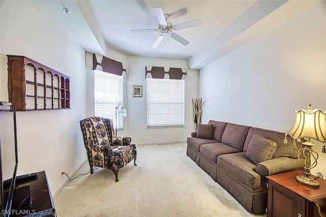 carpeted living room featuring ceiling fan