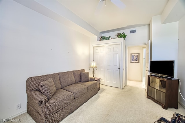 carpeted living room featuring ceiling fan