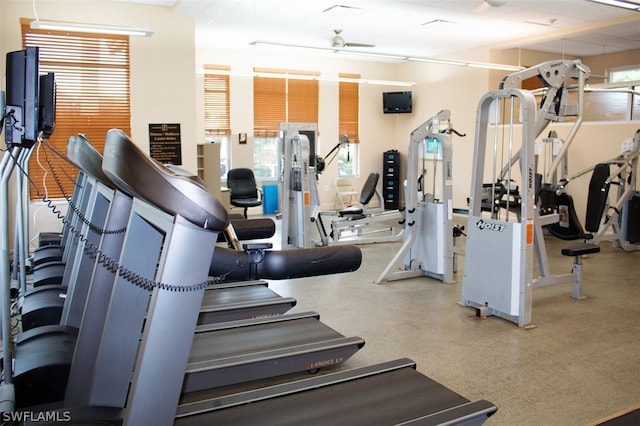 exercise room with ceiling fan