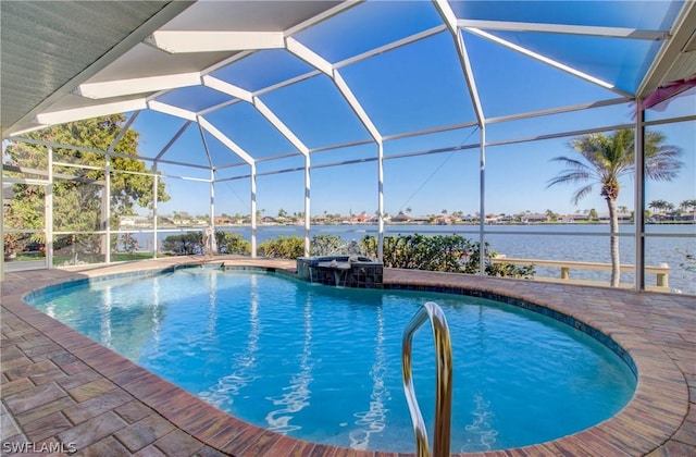 view of pool with a lanai, a water view, and a patio