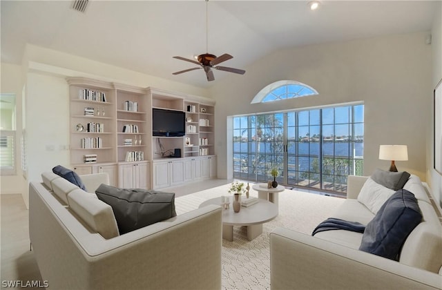 living room with ceiling fan and lofted ceiling