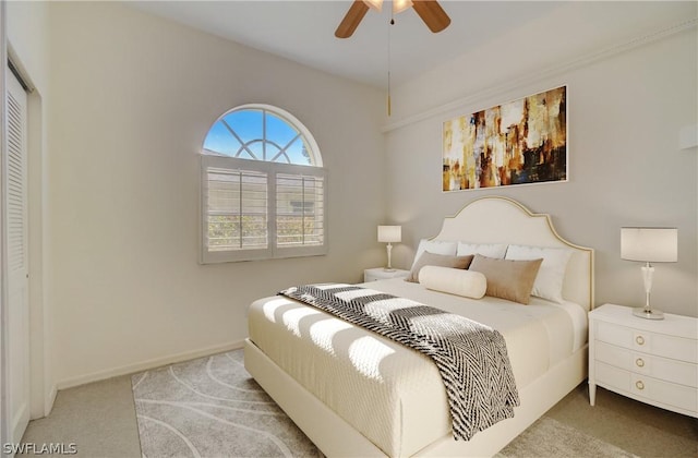 bedroom with carpet, ceiling fan, and a closet