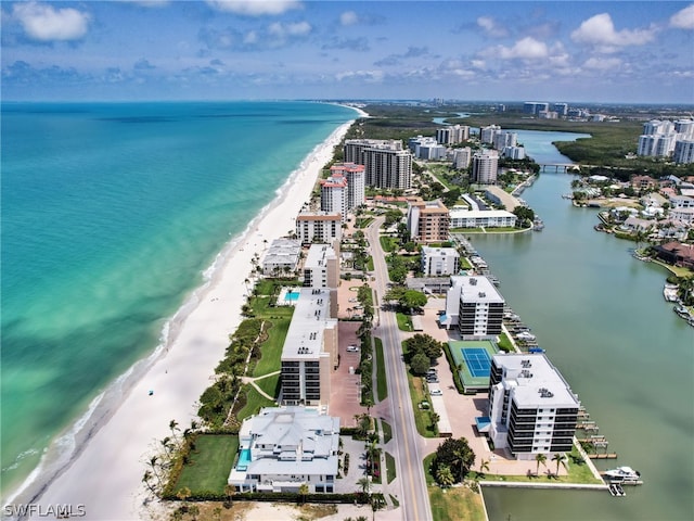 birds eye view of property featuring a water view and a view of the beach