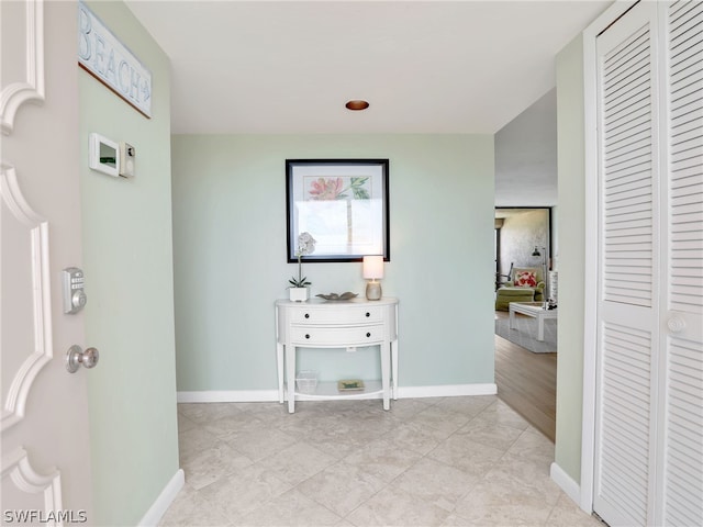 corridor featuring light tile floors