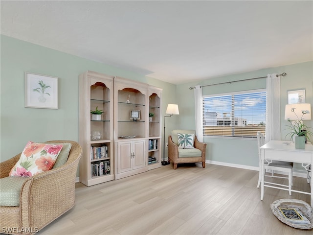 sitting room featuring light wood-type flooring