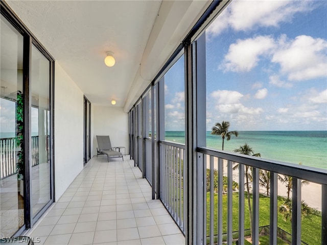 sunroom / solarium with a water view