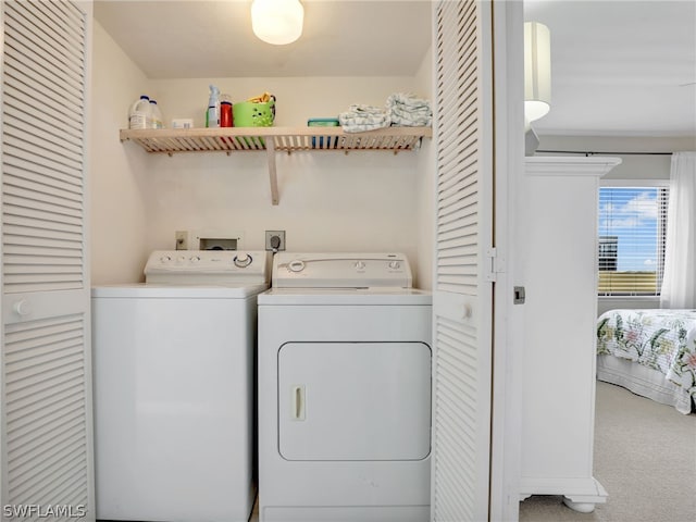 washroom with hookup for an electric dryer, carpet, and washing machine and clothes dryer