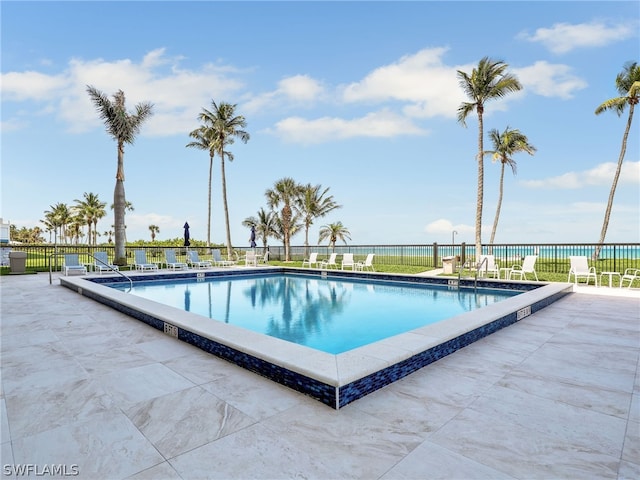 view of swimming pool featuring a patio area