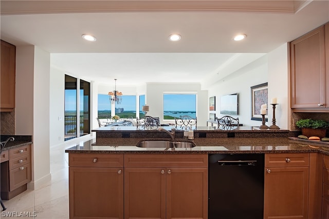 kitchen with dishwasher, decorative backsplash, dark stone counters, and sink