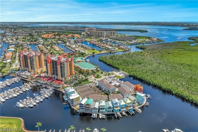 bird's eye view featuring a water view and a city view