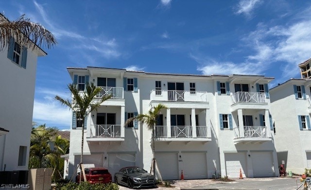 exterior space with a balcony and a garage