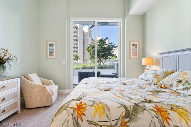 bedroom featuring access to outside and light carpet