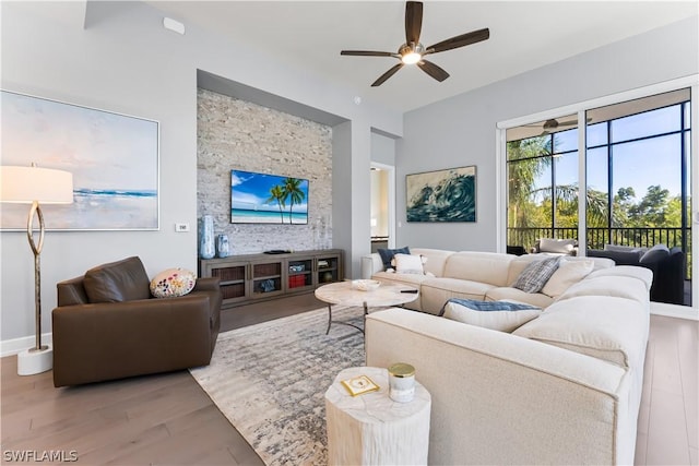 4142 Bay Beach Ln Unit 206, Fort Myers Beach, FL 33931 - living room featuring wood finished floors and a ceiling fan