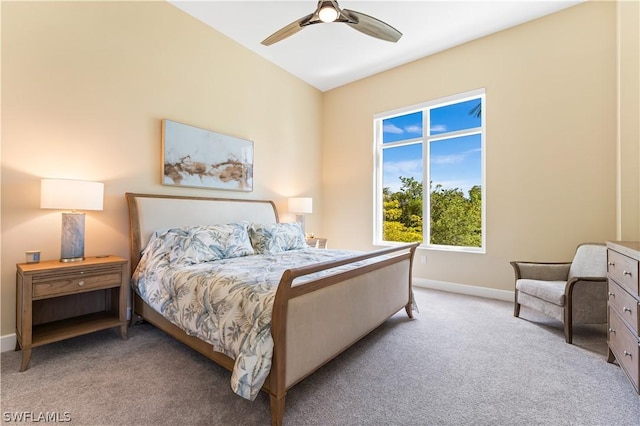 bedroom with ceiling fan and light colored carpet