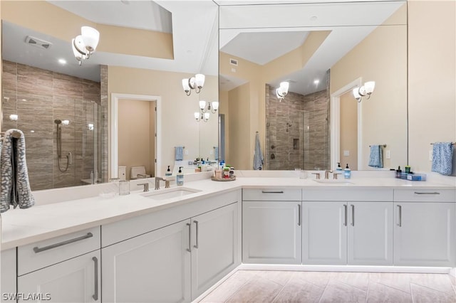 bathroom featuring vanity, toilet, and walk in shower