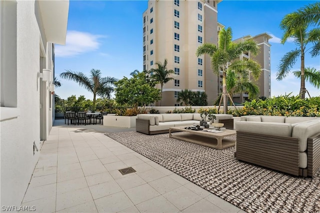 4142 Bay Beach Ln Unit 206, Fort Myers Beach, FL 33931 - view of patio featuring an outdoor living space and outdoor dining area