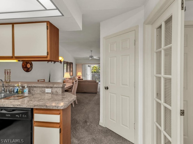 kitchen featuring kitchen peninsula, ceiling fan, sink, black dishwasher, and dark colored carpet