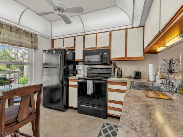 kitchen with ceiling fan, light tile floors, sink, white cabinetry, and black appliances