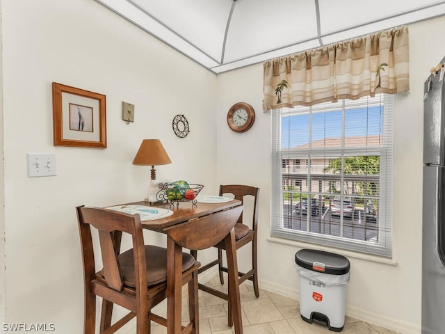 dining area with light tile floors