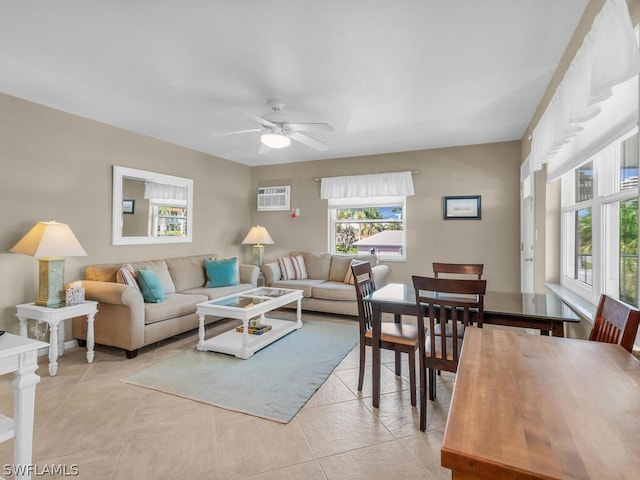 tiled living room with ceiling fan and a wall unit AC