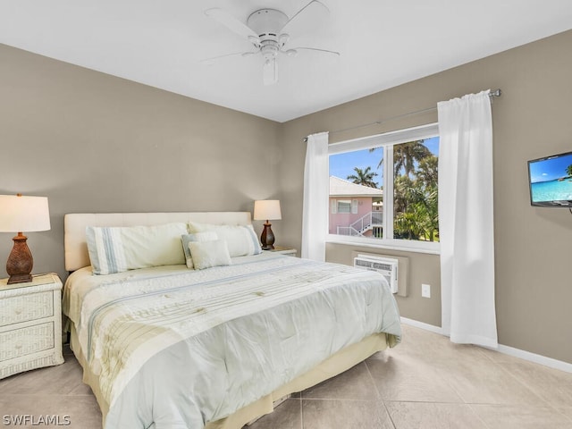 tiled bedroom with ceiling fan and an AC wall unit