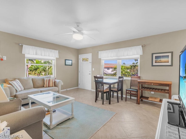 living room featuring light tile patterned floors and ceiling fan