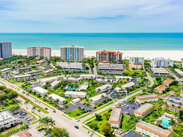 bird's eye view featuring a view of the beach and a water view