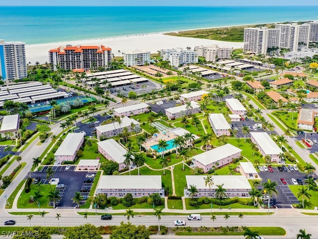 drone / aerial view featuring a view of the beach and a water view