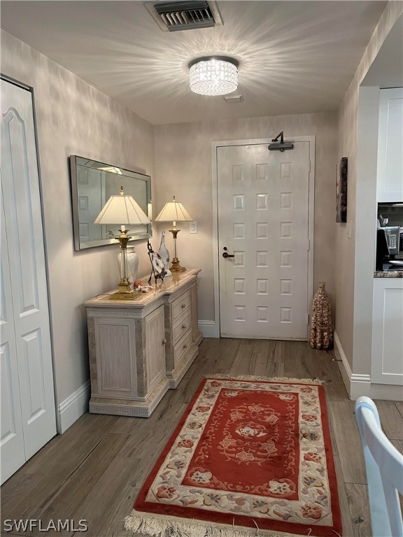 doorway featuring dark hardwood / wood-style floors