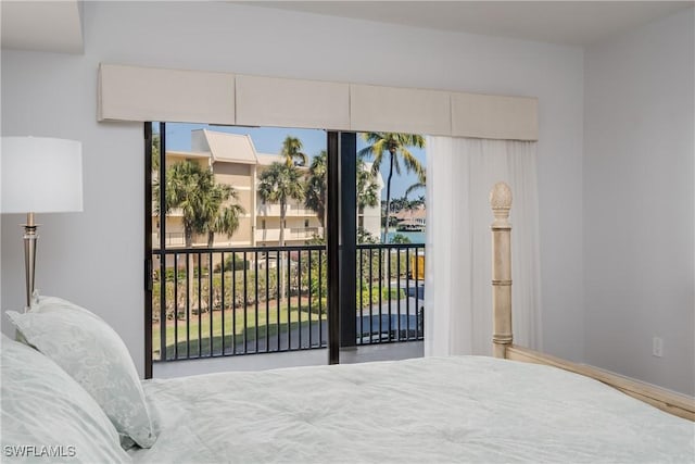 bedroom featuring multiple windows and access to exterior