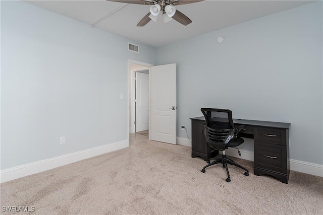 office space featuring ceiling fan and light colored carpet